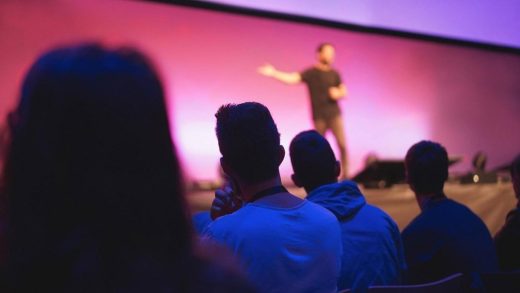 Audience watching a speaker on stage at a corporate product launch event in Dubai